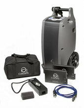 Load image into Gallery viewer, Front view of Oxlife Independence portable oxygen concentrator with wheels